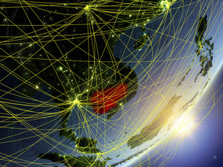 Cambodia on model of planet Earth with network during sunrise. Concept of new technology, communication and travel.