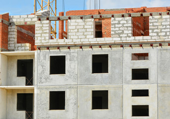 Construction site. Contemporary urban landscape. Nice photo of unfinished building  in a sunny day. Developing of modern civil engineering. Construction industry