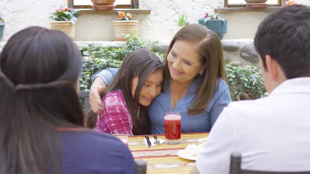 Hispanic family eating traditional meal together