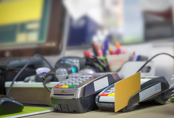 Credit Card reader on cashier table in supermarket
