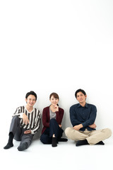 young asian group relaxing on white background