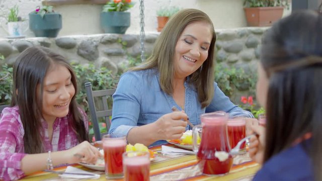 Hispanic family eating traditional meal together