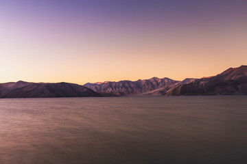 Sunset view with shades of the mountains on Pangong Tso, (Pangong lake) in Ladakh, India.