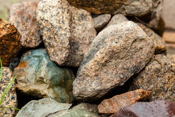 a lot of wet big stones after the rain
