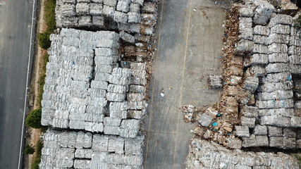 Plastic bottles,compressed into bales and ready for recycling aerial view