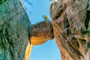 Falling stone sandwiched between two rocks