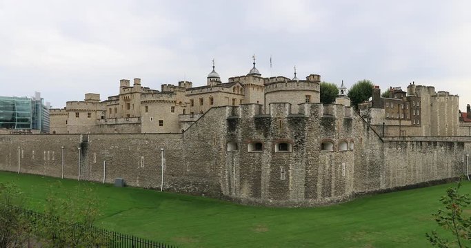 London Tower prison museum outer wall England pan. Officially Her Majesty's Royal Palace and Fortress of the Tower of London, a historic castle. Tourism and travel.