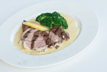 meat with sauce and vegetables