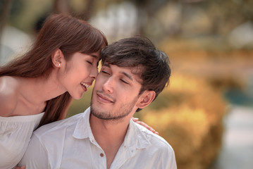 Asian romantic young couple in love, spending time together.
