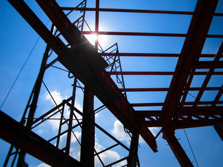 Fototapeta premium Structure of steel roof frame in Construction site, Silhouette shot.