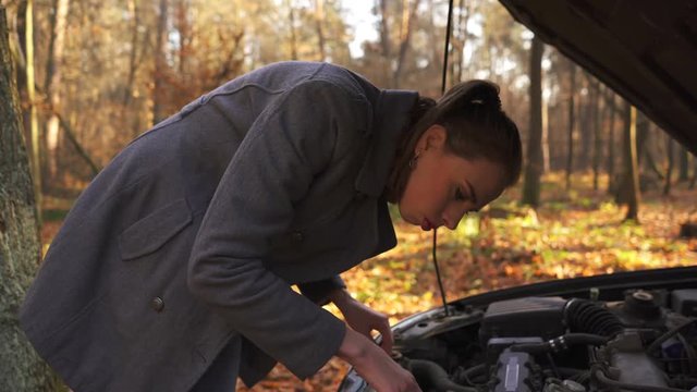       4K. Attractive sexy woman and car trouble. Confusion emotion , touch gage, steady shot