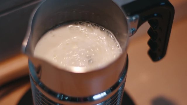 Milk foamer frothing milk in slow motion
