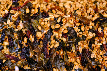 Fried peanut with chilly pepper - traditional asian street food. Asian, Indian and Chinese street food. Food court on local market of Langkawi island, Malaysia.