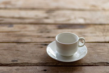 cup of coffee on a wooden table in the morning