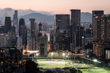 Sunset over Happy Valley district, famous for its horse racecourse  in Hong Kong island, Hong Kong SAR in China