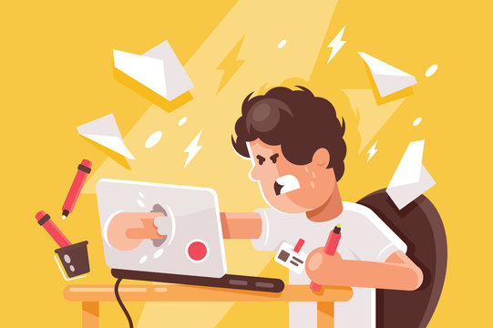 Stressed angry young man crashed laptop at work.