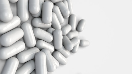 Pile of white medicine capsules