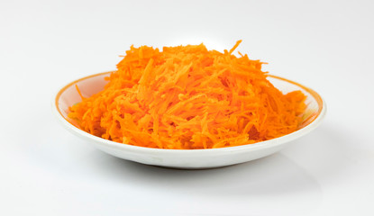 Grated raw carrot placed in plate