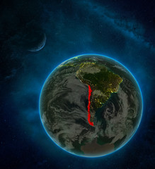 Chile from space on Earth at night surrounded by space with Moon and Milky Way. Detailed planet with city lights and clouds.