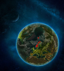 Norway from space on Earth at night surrounded by space with Moon and Milky Way. Detailed planet with city lights and clouds.