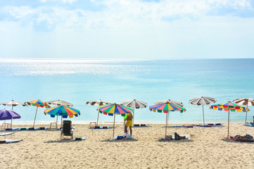 Obraz premium Tourists are enjoying their activities on the beach in a sunny day, Surin beach, Andaman sea, Phuket Thailand
