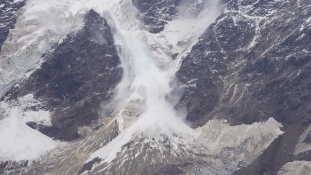 An avalanche in the mountains. Caucasian ridge, avalanche descended on the glacier
