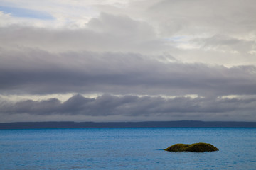 A single boulder in the ocean near Vancouver Island, British Columbia, Canada