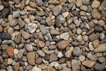 beautiful multi-colored pebbles on the sea, rest