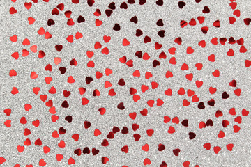 Silver background with red confetti hearts for Valentine Day