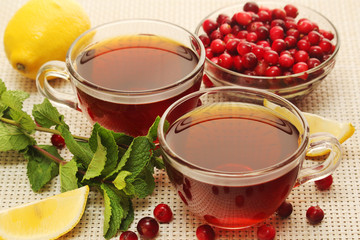 Hot tea with lemons, mint and cranberry