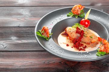 Stuffed squid with parmesan cheese, onion and parsley in tomato sauce