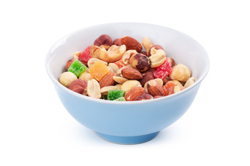 Bowl of nuts and candied fruits isolated on white background