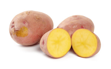 raw potato tuber with slices isolated on white