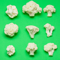 Cauliflower pieces on a bright green background