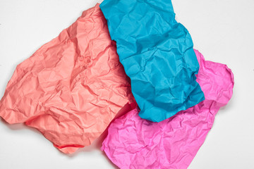 close up of a crumpled paper with curled edge on white background