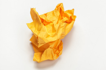 close up of a crumpled paper with curled edge on white background