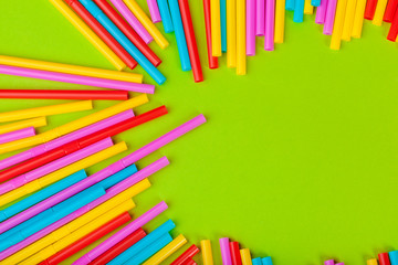 Colorful straws for beverage soft drink on colored background