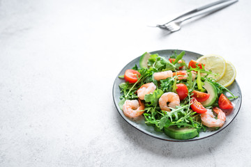 Shrimp avocado arugula salad