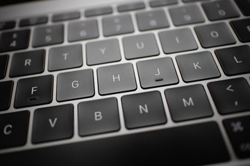Close up of black keyboard button of a laptop.