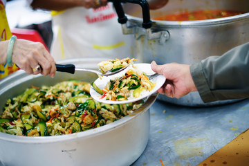 Beggar begs food from donors: concept of poverty in Asian society