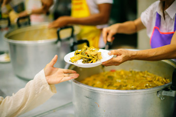 Beggar begs food from donors: concept of poverty in Asian society