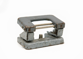 old vintage hole punch on white isolated background