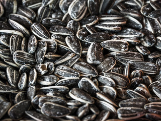 Pile of sunflower seeds for background. Black sunflower seeds