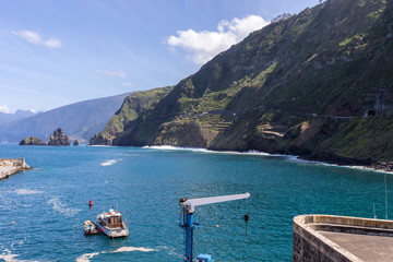 Fototapeta na wymiar Porto Moniz, Madeira, Portugal - April 18, 2018: Fishing port and marina in Porto Moniz on the north coast of Madeira. Portugal