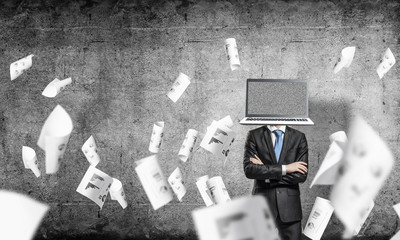 Businessman with laptop instead of head.