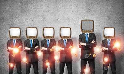Businessmen with old TV instead of head.