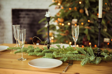 Christmas, holidays and eating concept - table served for festive dinner at home