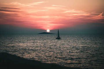 sunset at the sea with boat
