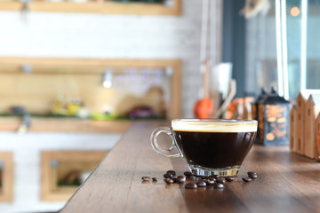 Coffee on wooden counter in cafe.