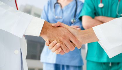 Healthcare people group. Professional doctor working in hospital office or clinic with other...